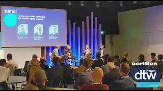Image of panellists on stage at a conference